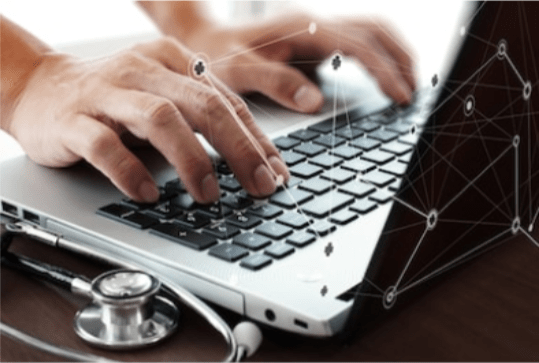 Entering medical journal entry in a laptop – Medical journal concept.
