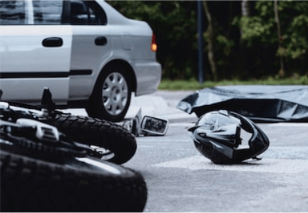 Motorcycle helmet on the street after a fatal accident with a car.