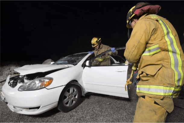 Rescuers at the scene of a car accident case during the night.