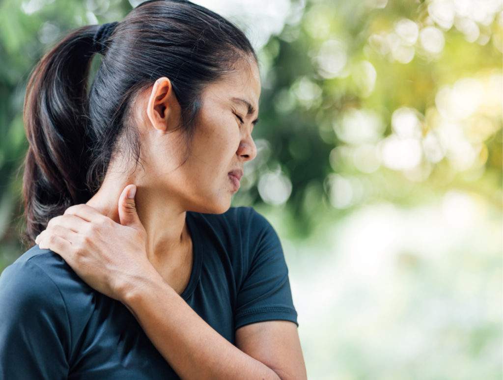 An injured woman holding her neck