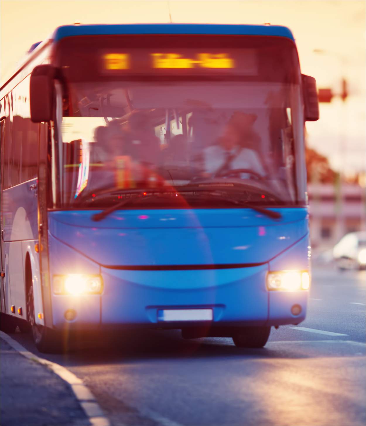 A bus driving on the highway