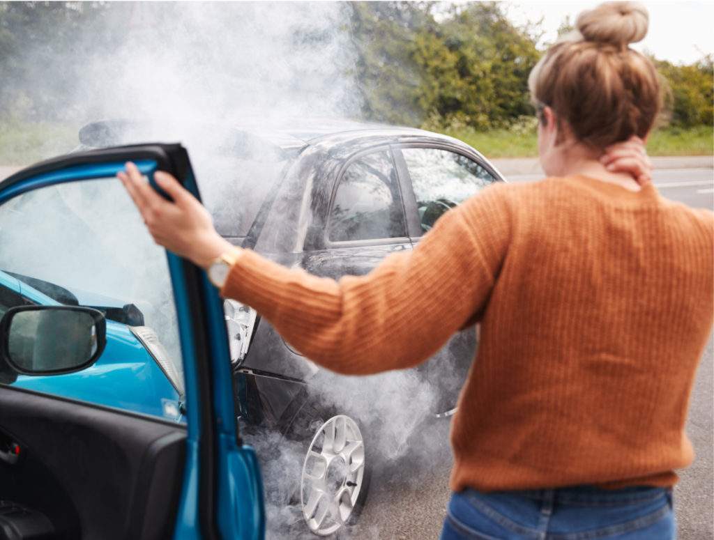 A car accident victim exiting her car