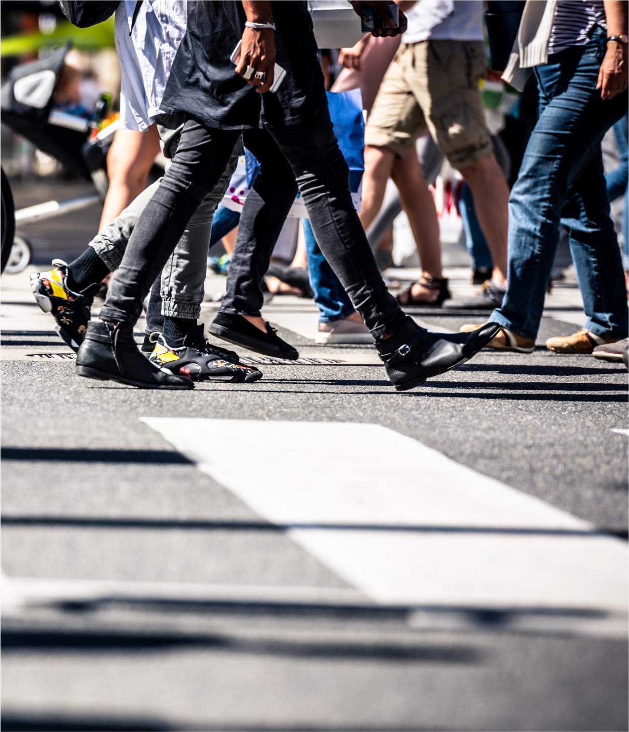 A group of pedestrians walking through a crosswalk